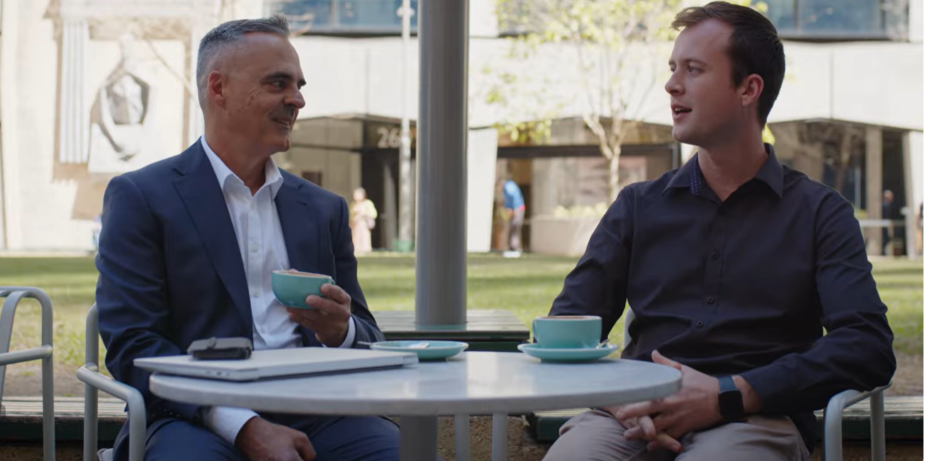 Brett having a business conversation over coffee